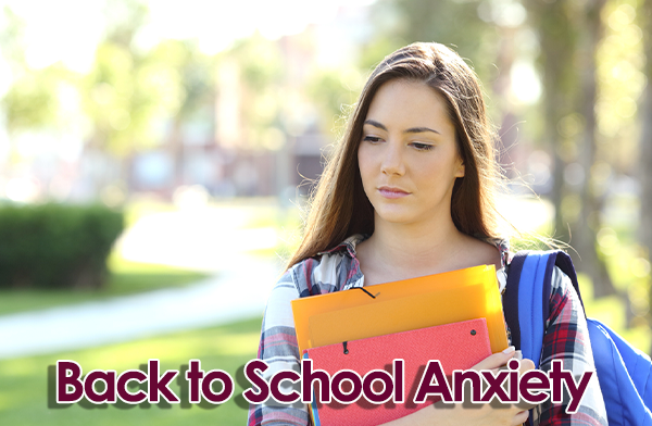 Anxious girl holding books. Caption: Back to School Anxiety