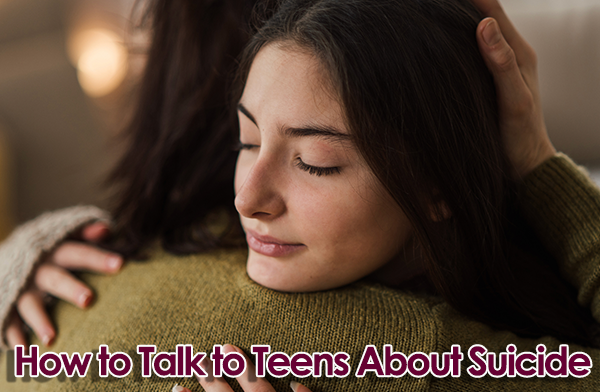 Teen girl and parent embrace. Text overlay reads "How to Talk to Teens About Suicide"